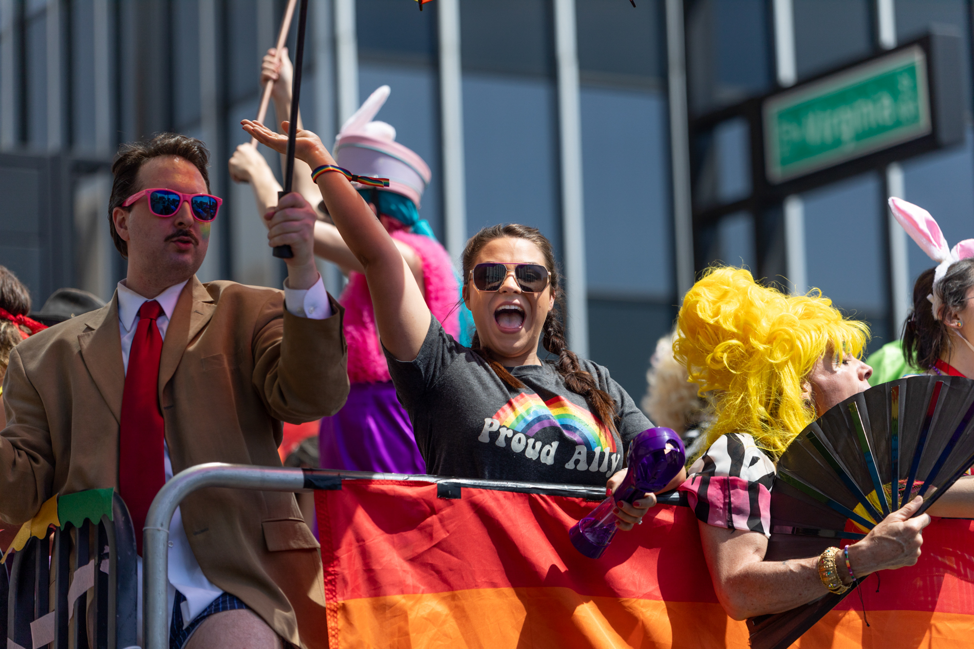Parade participants wave to the crowd at the Northern Nevada Pride parade on Saturday, July 22, 2023. (Trevor Bexon/The Nevada Independent)